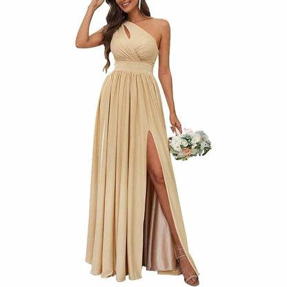 A bridesmaid in a beige one-shoulder chiffon dress with a V-neck neckline and sleeveless design, holding a bouquet of flowers.