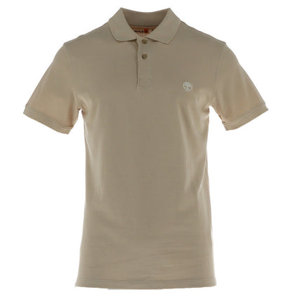 Image 1 : Polo homme Timberland piqué beige, vue de face, col polo 3 boutons et logo arbre brodé poitrine gauche — Delvale